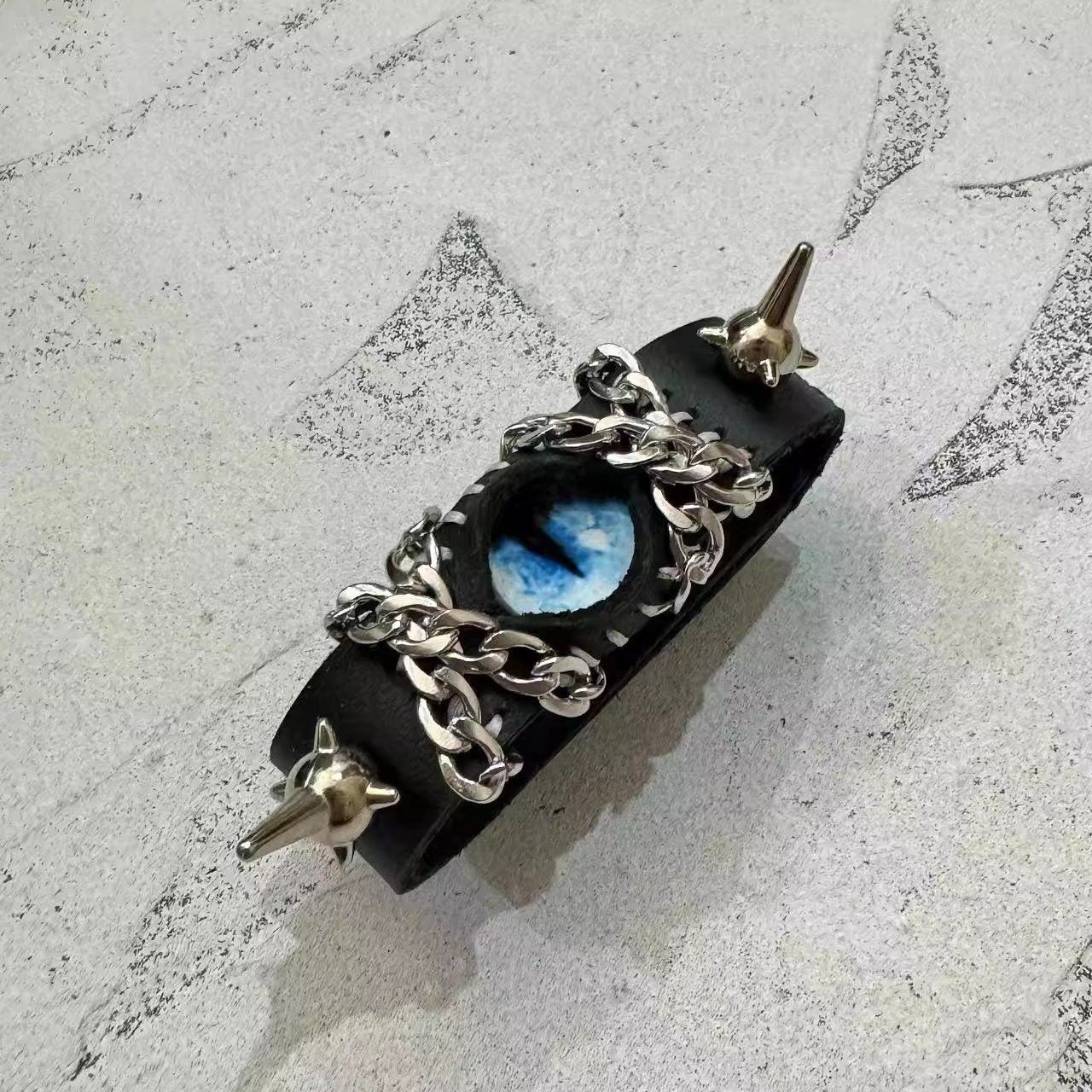 Gothic Black Leather Blue Dragon Eye Bracelet - Spiked Chain Cuff - Electric Blue Pupil Wristband - Cyberpunk Aesthetic