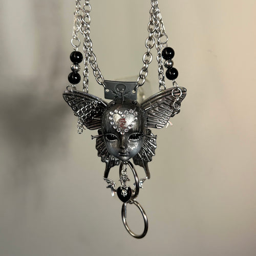 Silver Metallic Butterfly Doll Face Necklace with Rhinestone Heart & Winged Skull Charm - Crux Jewelry product image 1