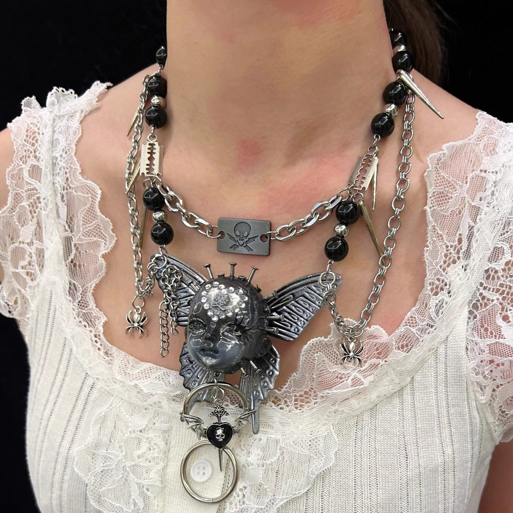 Silver Metallic Butterfly Doll Face Necklace with Rhinestone Heart & Winged Skull Charm