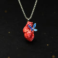 "Fluttering Heart" Anatomical Pendant - Shimmering Blue Butterfly Detail