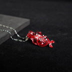 "The Little Mermaid" Fossilized Heart Necklace - Skeleton Tail Detail