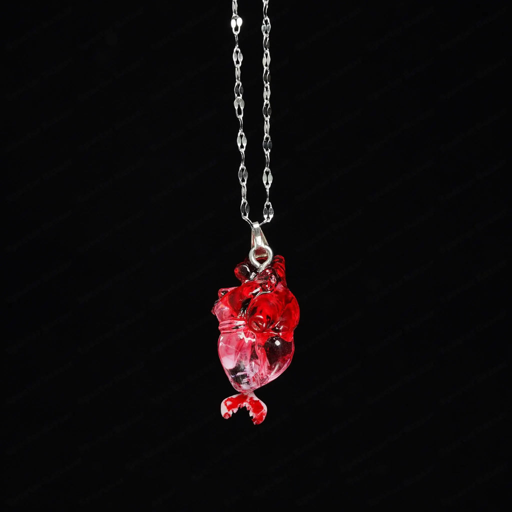 "The Little Mermaid" Fossilized Heart Necklace - Skeleton Tail Detail