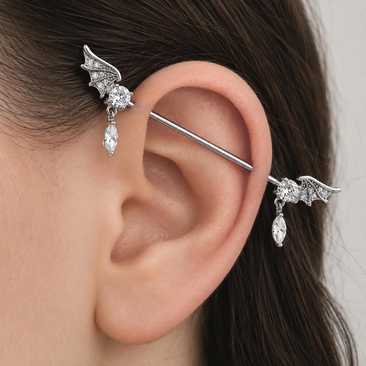 Bat Wing Crystal titanium industrial barbell, detail view 2