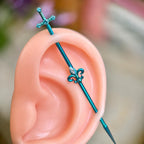 Fleur-de-Lis Sword titanium industrial barbell, detail view 3
