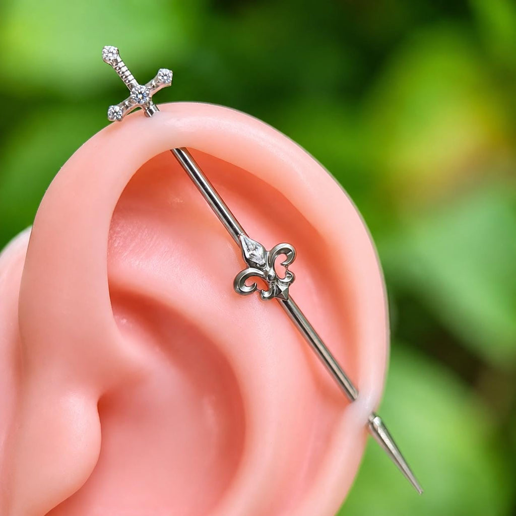 Fleur-de-Lis Sword titanium industrial barbell, detail view 4