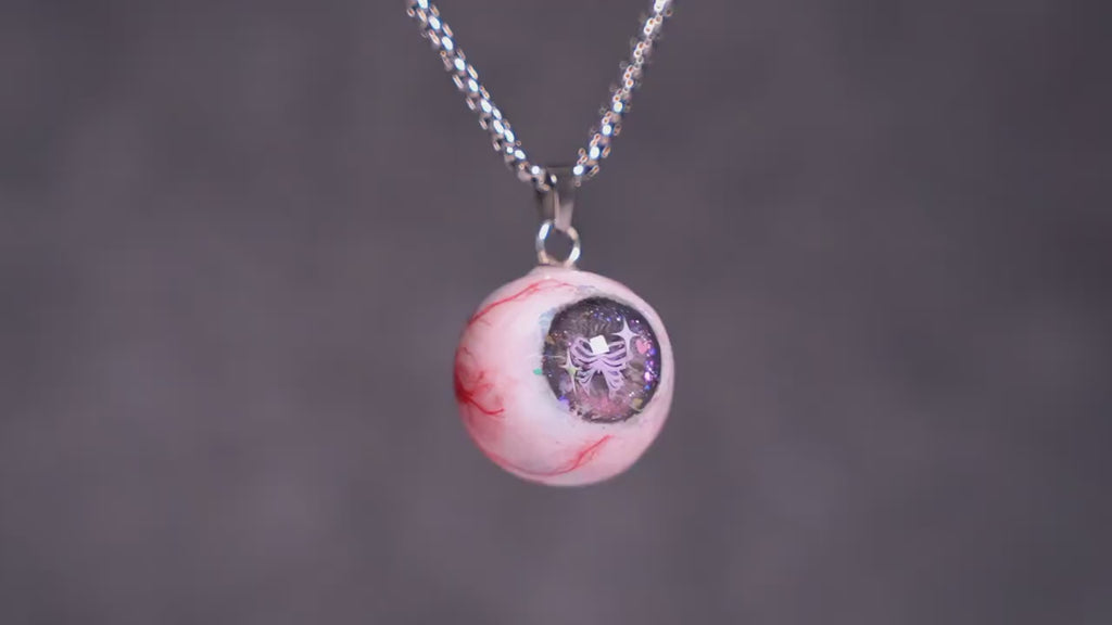"Pretty Creepy" Coquette Bow Eyeball Necklace - Pink Glitter Ribbon Pupil